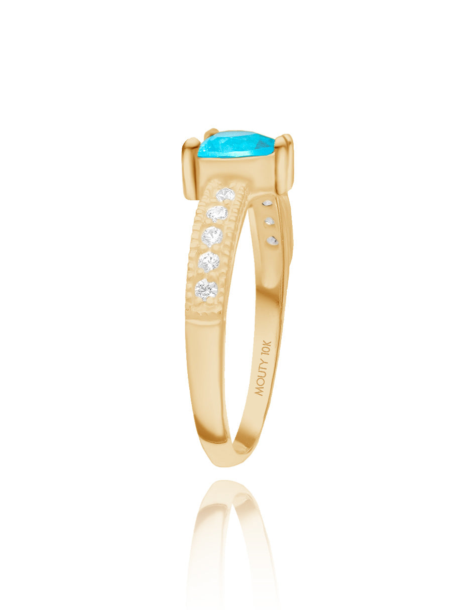 Anillo Fanny en plata con baño de oro amarillo con circonia azul cielo