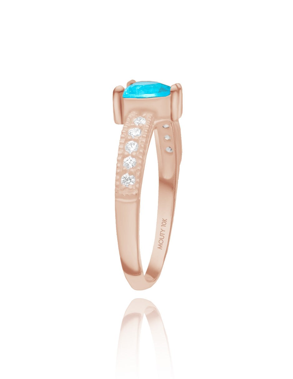 Anillo Fanny en plata con baño de oro rosa con circonia azul cielo