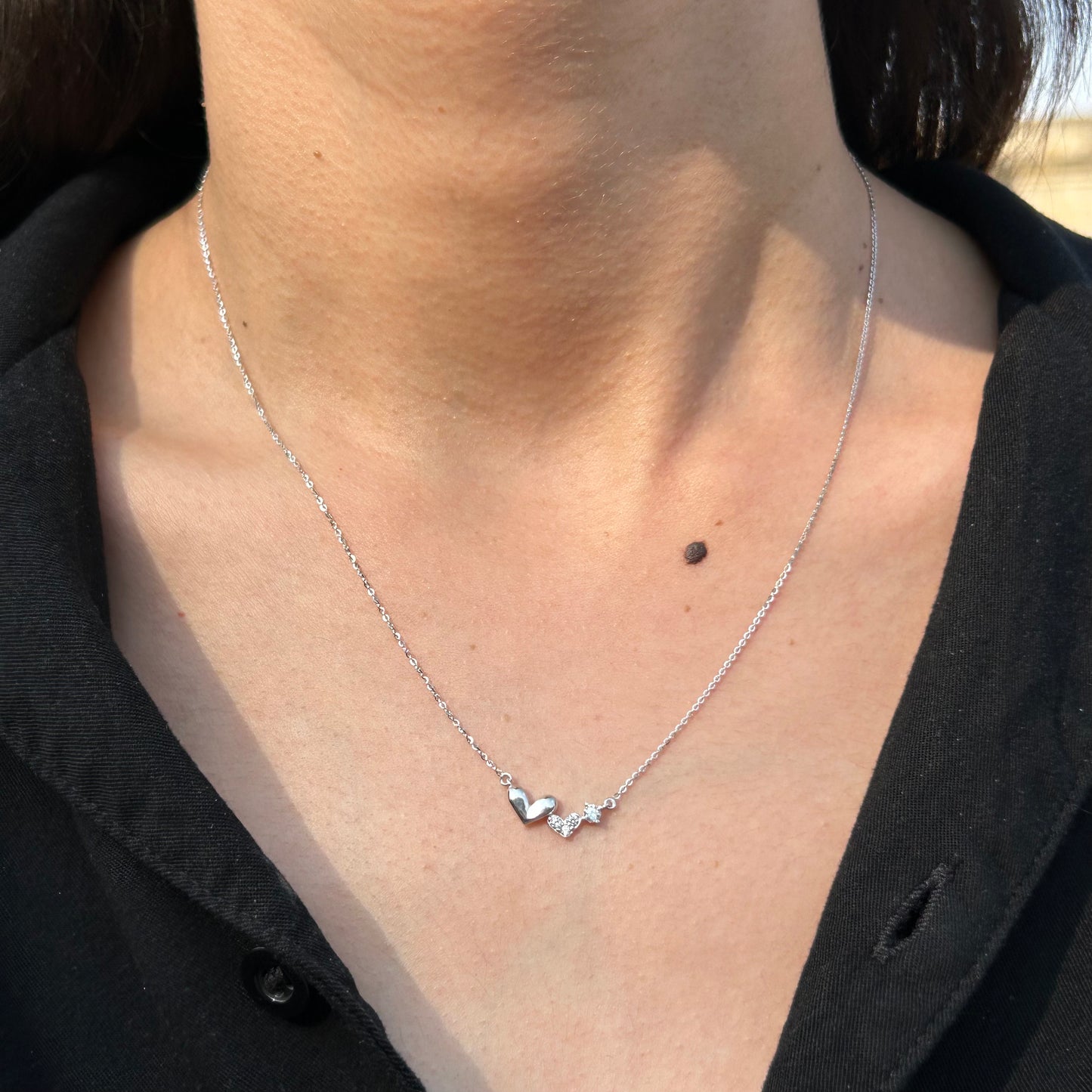 Three hearts necklace in 10k Italian white gold with zirconias