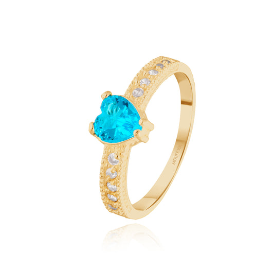 Anillo Fanny en oro amarillo 10k con circonia azul cielo